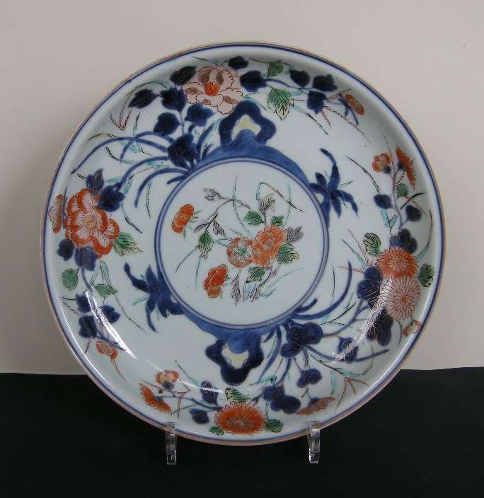 Porcelain dish decorated with flowers enameled in green yellow iron red gold and underglaze blue